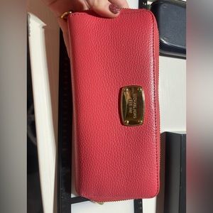 Coral with gold accent Michael Kors wallet.